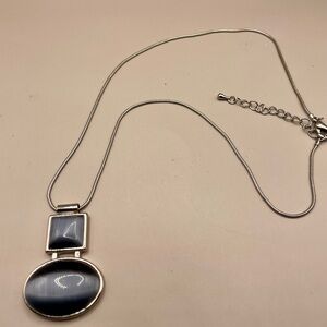 Silver grey moonstone pendant in a silver tone snake chain. 18 inches. Colorful